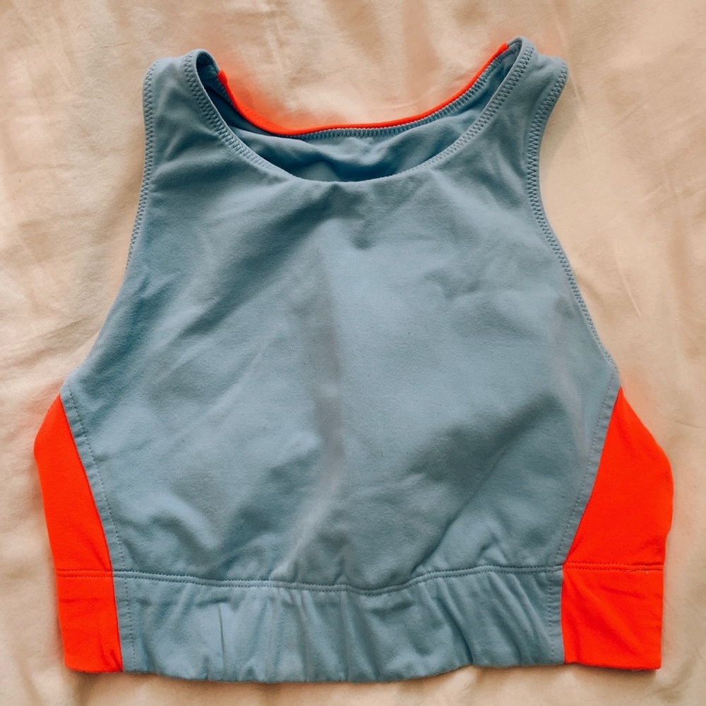 Neon orange and light blue sports bra